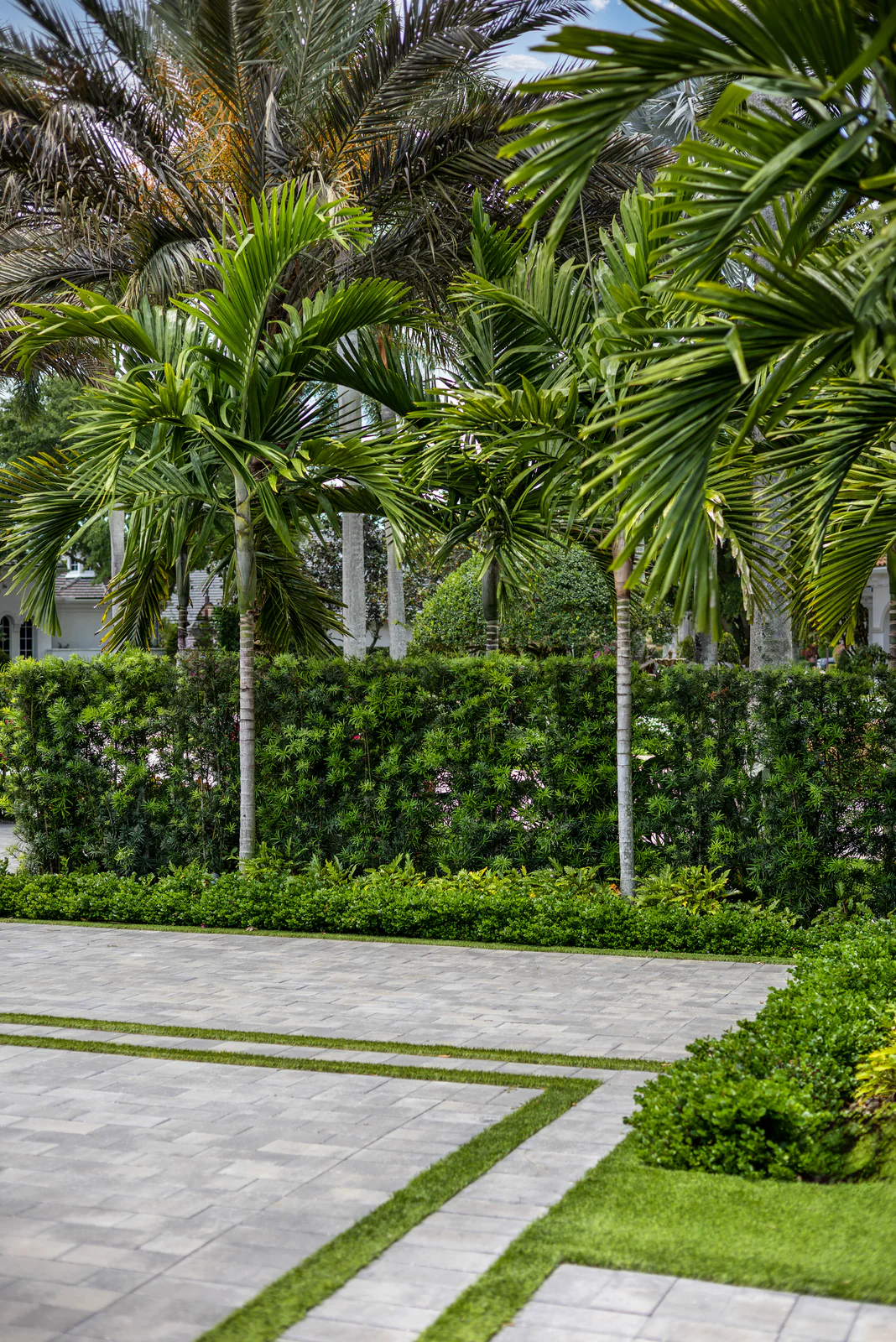A gated community entrance with seasonal colour, maintained by Power Group Care
